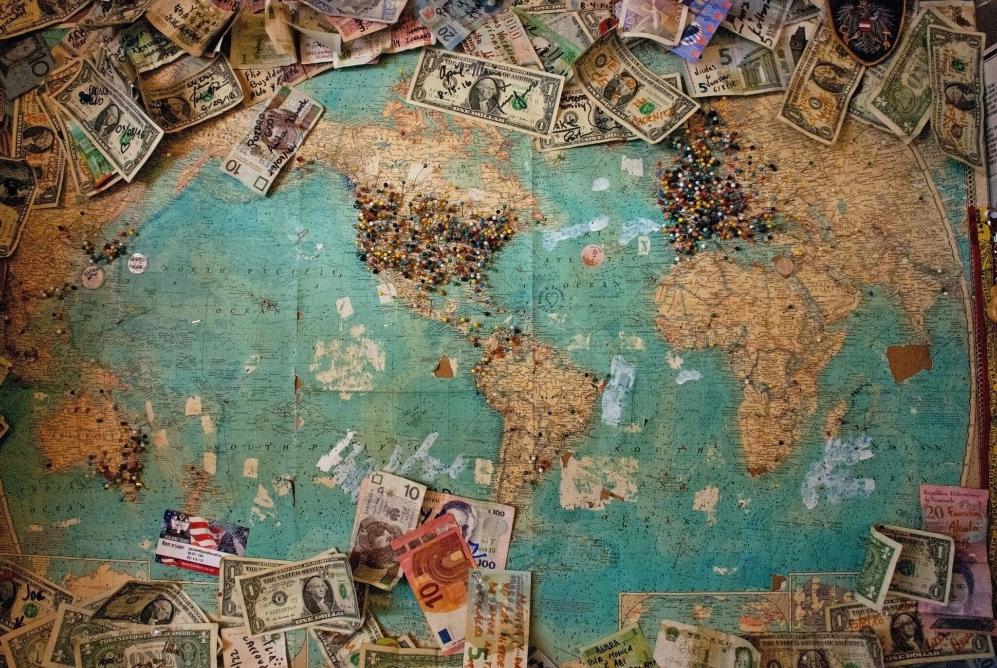 U.S. dollar and Euro banknotes with map