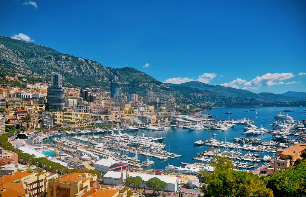 Monaco harbour with luxury yachts and hillside apartments