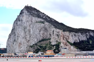 The Rock of Gibraltar rising above the runway and town