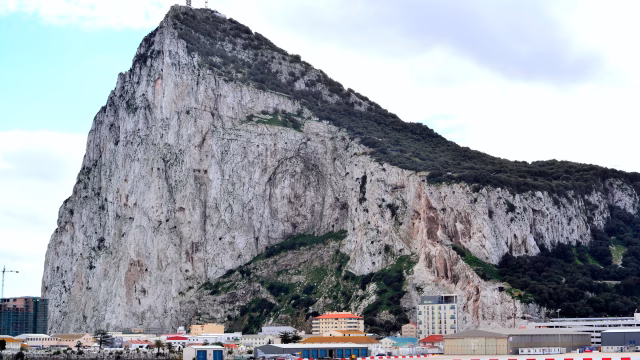 The Rock of Gibraltar rising above the runway and town