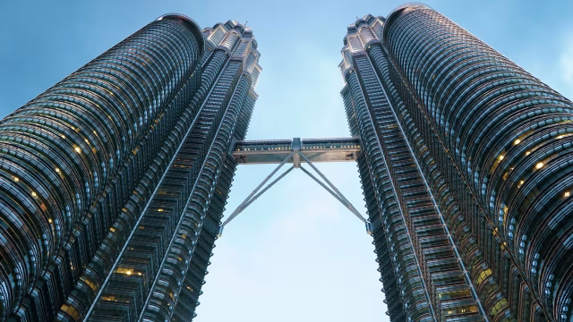 Petronas Twin Towers and sky bridge seen from below in Kuala Lumpur, Malaysia